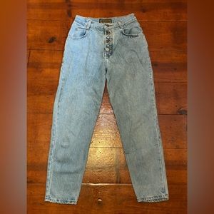 Vintage denim jeans with zig-zag button detail. No rips, no stains.